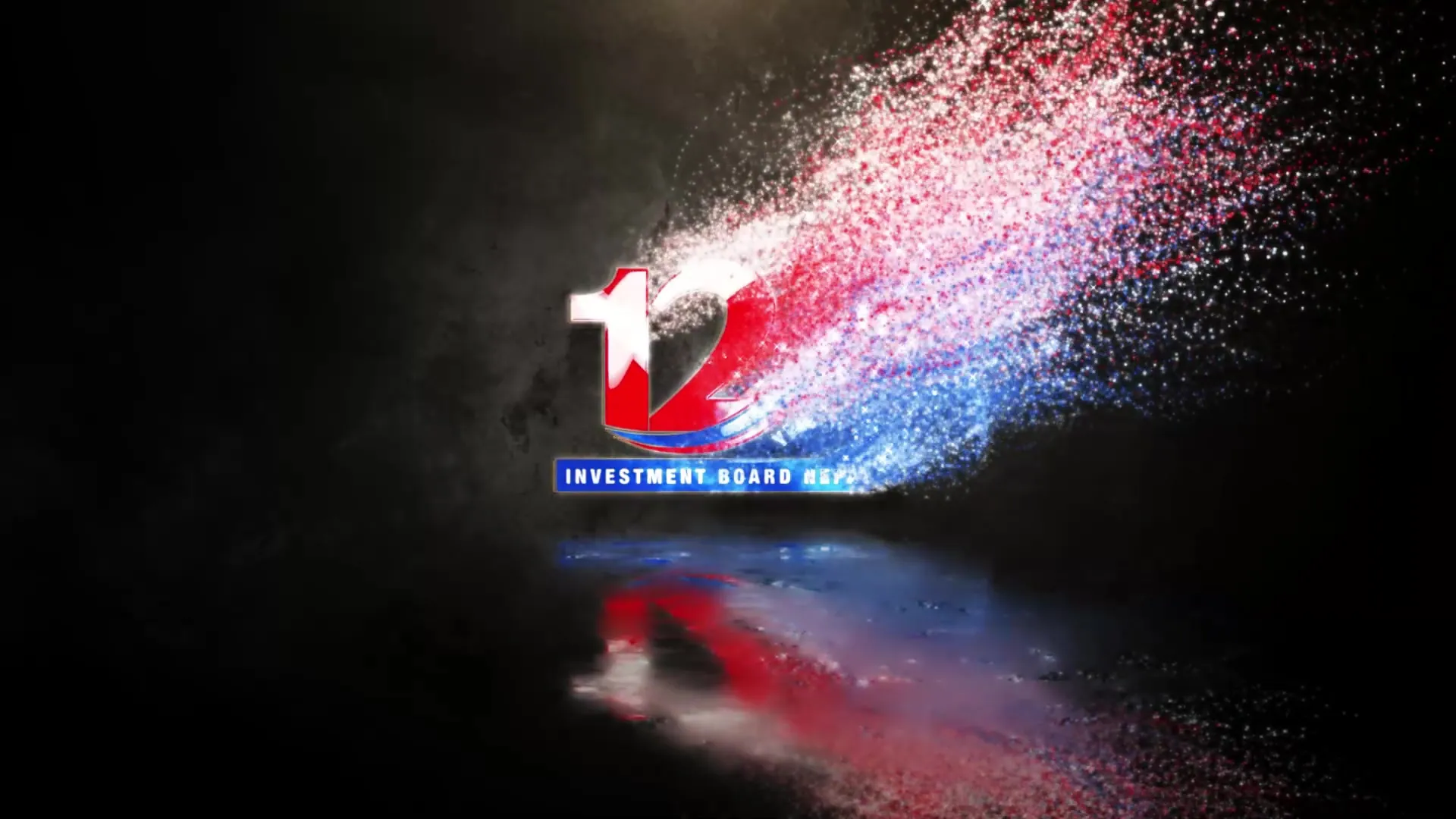 Red, blue and white particles streaming across the frame as the colour 12 logo forms, with a reflection beneath.