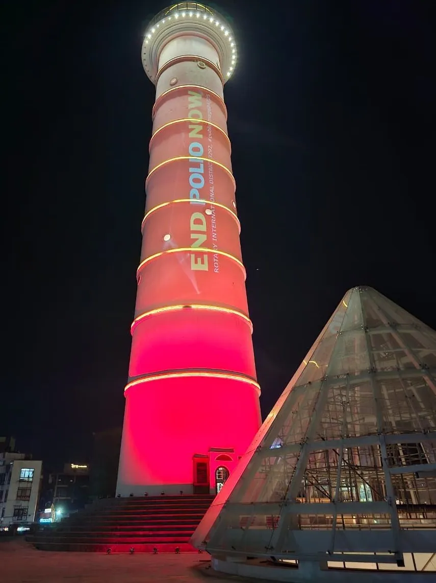 The tower lit red with the words End Polio Now and Rotary International District 3292 running up the shaft.